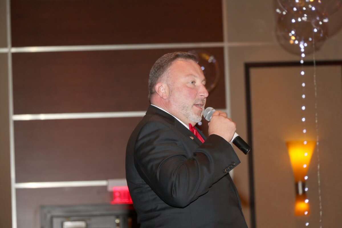 Pete Chryss speaking at a community gala